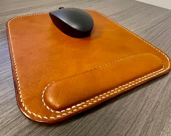 Custom leather mouse pad with wrist support.