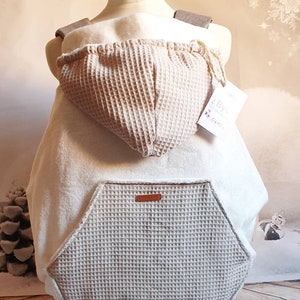 Cream carrying cover, universal for any baby carrier. With optional waterproof cover