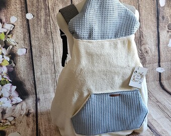 Cream-colored baby carrier cover, universal for any baby carrier backpack. With optional waterproof cover.