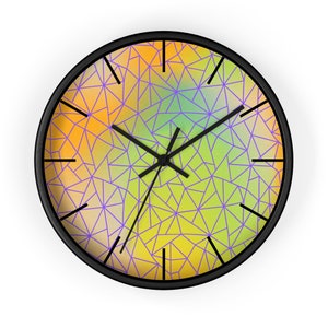 May include: A round wall clock with a black frame and a colorful geometric design. The clock face features a gradient of yellow, orange, green, and purple colors with a purple geometric pattern overlayed on top. The clock hands are black.