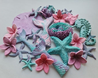 24 pcs. Sugar fondant mermaid tail, fin, corals, seahorse, starfish, Hawaii flowers cake topper decorations. Purple, sea green, teal, pink.