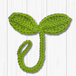 May include: A green crocheted sprout with two leaves. The text "CROCHET SPROUT" is below the sprout.