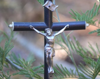 Old blackened wooden crucifix on foot late nineteenth century Napoleon III era