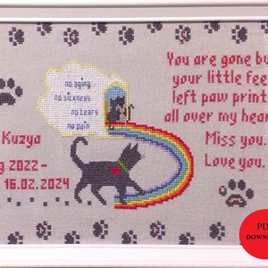 May include: Framed cross-stitch with a black cat design, rainbow, and text. The text reads: "You are gone but your little feet left paw prints all over my heart. Miss you. Love you." Includes paw prints and the dates "aug 2022-16.02.2024".
