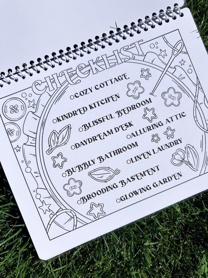 May include: A spiral-bound notebook with a black and white checklist design. The word "CHECKLIST" is at the top, with themed room names like "Cozy Cottage" and "Glowing Garden" listed below. Decorative elements include stars, flowers, and sewing tools.
