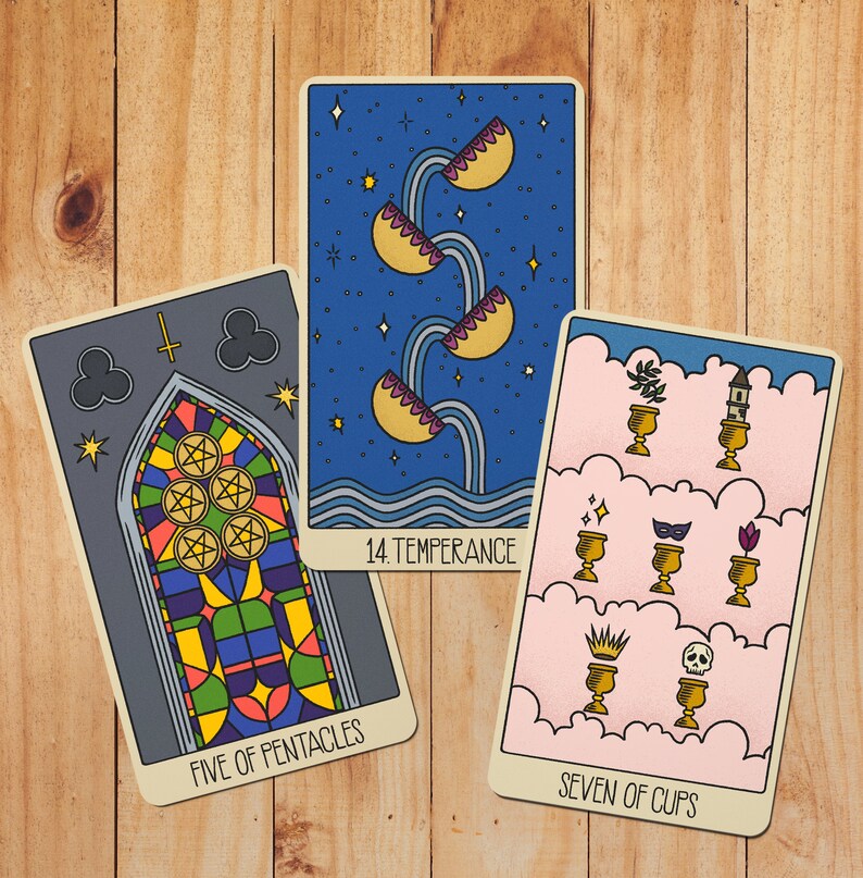 May include: Three tarot cards featuring Five of Pentacles with a stained glass window design, 14 Temperance showing water pouring between cups against a starry blue sky, and Seven of Cups displaying various objects in golden chalices on pink clouds.