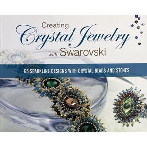 May include: Book cover with the title "Creating Crystal Jewelry with Swarovski" and a subtitle "65 Sparkling Designs with Crystal Beads and Stones". The cover features a close-up of a crystal bracelet and a crystal ring.