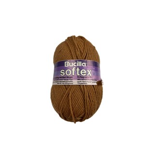 May include: A ball of brown Bucilla Softex yarn, a worsted weight acrylic yarn. The label reads "Bucilla Softex" and includes information about the yarn's weight, fiber content, and care instructions.