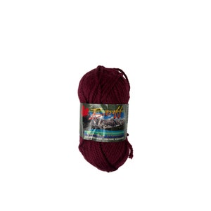 May include: A ball of deep burgundy yarn with a label that reads "Baft Canadian Warmth 100% Merino Wool - Machine Washable".