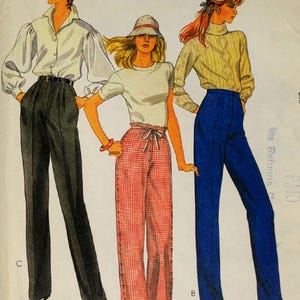 May include: A sewing pattern illustration featuring three outfits: a white long-sleeve blouse with dark gray trousers, a white t-shirt with a bucket hat and red checkered pants, and a cream cable-knit sweater with solid blue high-waisted trousers.