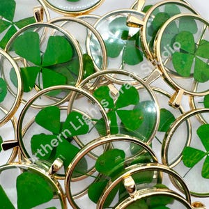 May include: A set of three ceramic mugs with a speckled, matte finish. The mugs are in shades of cream, light gray, and dark gray. Each mug has a simple, minimalist design, perfect for coffee or tea.