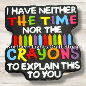 May include: Black and white text on a black background reads "I have neither the time nor the crayons to explain this to you".  A row of colorful crayons is visible in the middle of the text.