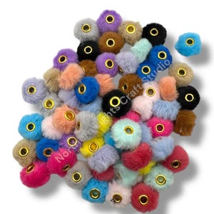 May include: A white ceramic mug with a black handle and the text "But First, Coffee" in a bold, black font. The mug is set against a blurred background, suggesting a cozy setting. The mug appears to be approximately 4 inches tall.