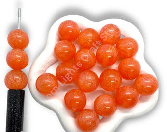 Cuentas de 16 mm con purpurina color naranja melón - 20 unidades.