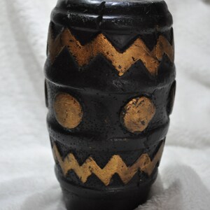 Original African candle with motif djembee drum all around