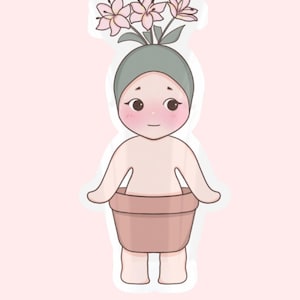 May include: A white ceramic mug with a black handle and the text "But First, Coffee" in a black, handwritten-style font. The mug is on a white surface.