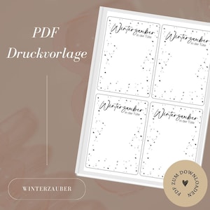 Op de afbeelding: Een witte PDF-afdruk met vier rechthoekige sjablonen, elk met de tekst "Winterzauber in der Tüte" en een decoratieve rand van kleine zwarte hartjes. De woorden "PDF Druckvorlage" zijn ook zichtbaar.