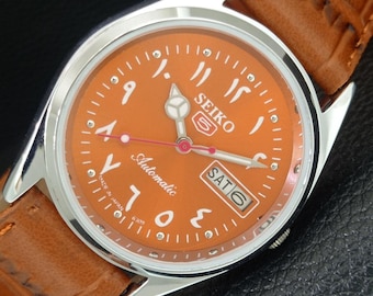 Relógio de pulso masculino Seiko 5 vintage automático com dia/data, recondicionado, modelo 6309a, com mostrador laranja e numeração arábica, fundo transparente (a442411-1).