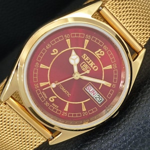 Reloj de pulsera Seiko 5 automático vintage 6309a reacondicionado, fabricado en Japón, para hombre, con indicador de día y fecha, esfera roja y fondo transparente (a443479-1)