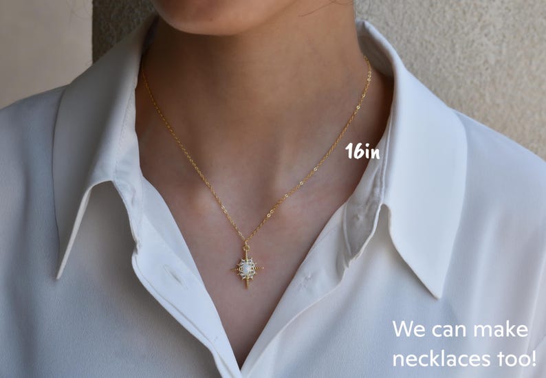 a woman wearing a white shirt and a gold necklace
