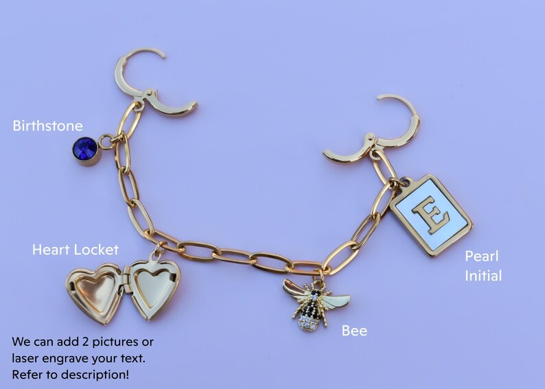 a gold bracelet with charms and a bee