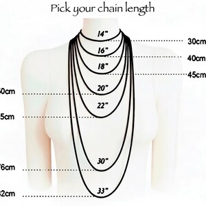The image is a diagram that shows the different chain lengths in centimeters, ranging from 18 to 82 centimeters. It provides a visual representation of the various chain lengths available for selecting a necklace length.
