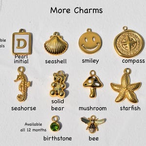 a bunch of charms that are on a piece of paper
