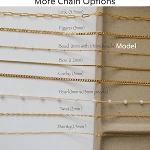 a bunch of different types of necklaces on a table
