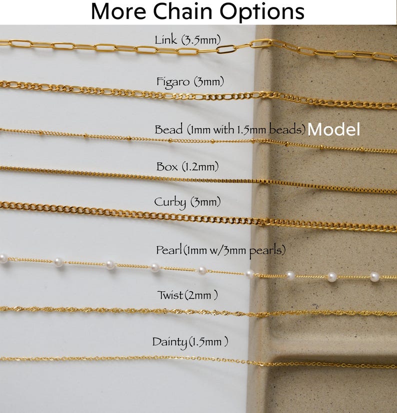 a bunch of different types of necklaces on a table