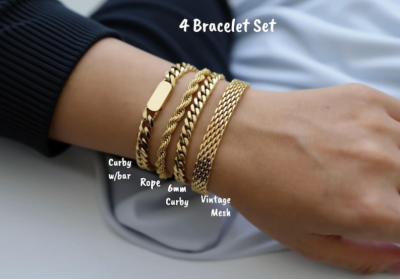 A close-up of a person's wrist wearing a gold bracelet set with four different types of bracelets.