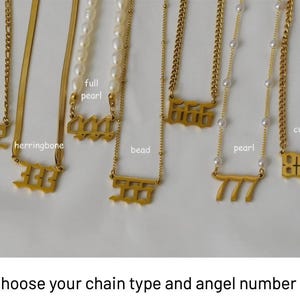 a collection of gold necklaces with various numbers and designs, including 555, 666, 777, and 999.