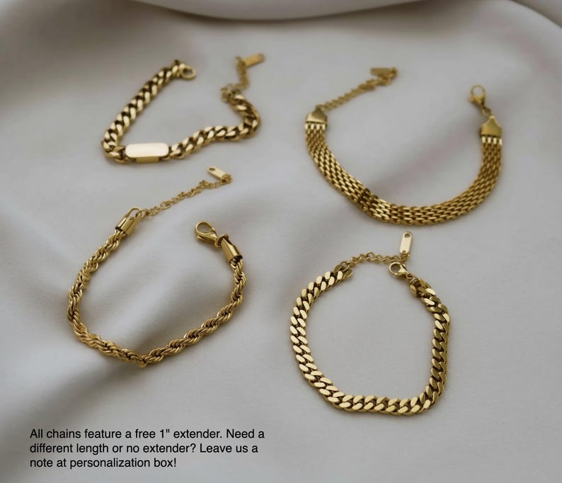 a collection of gold-colored bracelets arranged on a white background.