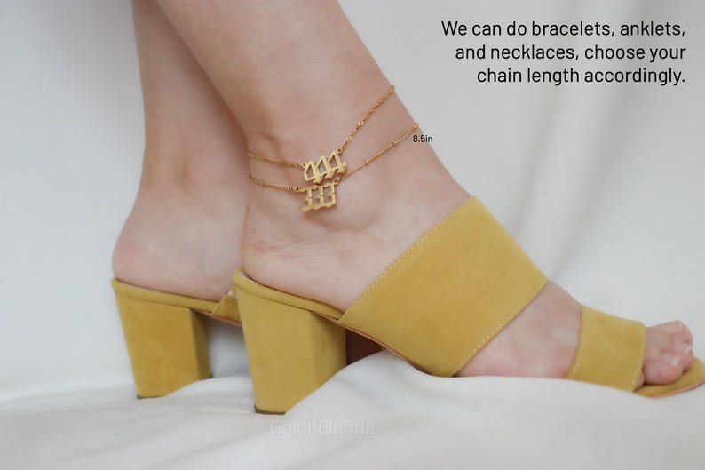 A close-up of a person's feet wearing yellow high-heeled sandals, with a gold-colored ankle bracelet on their ankle.