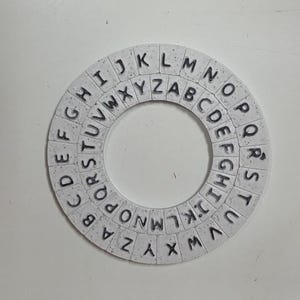 Anello cifrante di Cesare - Puzzle rotante con codice segreto immagine 2