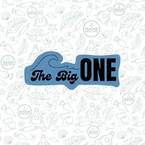 May include: White background with a pattern of baking-related illustrations, including rolling pins, aprons, and mixers. A blue wave shape contains the text "The Big ONE" in black. The image also features the text "SEASIDE SWEET SHOP".