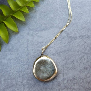 Sustainable jewelry, ethical pebble pendant, recycled gold, conscious gift