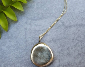 Sustainable jewelry, ethical pebble pendant, recycled gold, conscious gift