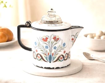 Caffettiera svedese vintage Berggren con decorazioni floreali, smalto bianco e finiture nere, ideale per la cucina.