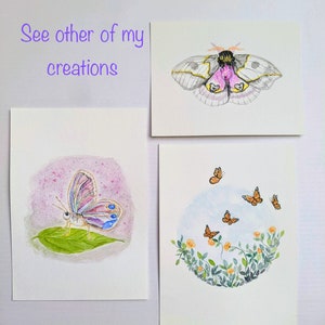 May include: Three watercolor paintings of butterflies. The first painting features a pink and blue butterfly on a green leaf. The second painting features a pink and yellow moth with black markings. The third painting features a circle of green leaves and yellow flowers with five orange butterflies flying around it.