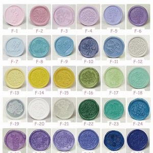 May include: Thirty wax seals with various designs and colors. The seals are round and have a raised design. The designs include butterflies, flowers, hearts, leaves, and geometric patterns. The colors include pink, blue, yellow, green, purple, and white.