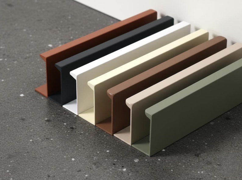 May include: Seven rectangular metal shelves in a row, in shades of rust, black, white, beige, brown, light brown, and olive green. The shelves are on a speckled grey surface.
