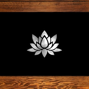 May include: A black background with a white lotus flower design in the center.