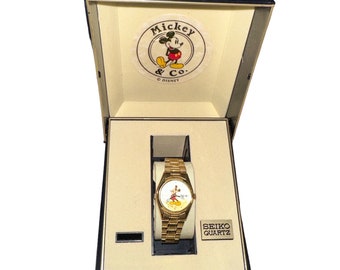Vintage 80’s Seiko Quartz Day Date Gold Tone Sunburst Radiant Dial Mickey Mouse Womens Watch With Original Box Japan Movement Made