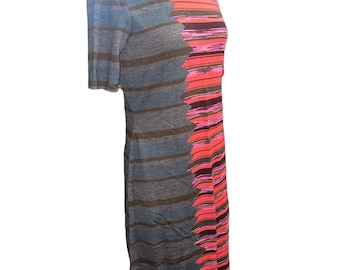 May include: A striped turtleneck dress with a geometric pattern in shades of gray, blue, pink, and black.