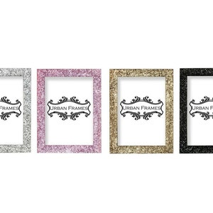 May include: Four glitter picture frames in silver, pink, gold, and black. Each frame has a white mount and the text "URBAN FRAMES" in a black, decorative font.