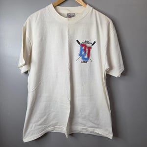 Maglietta vintage Big Johnson Crew Rowing Stroke Humor bianca con cuciture singole, taglia L, prodotta negli Stati Uniti.