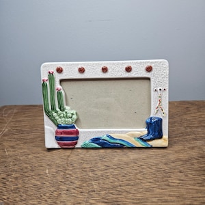 May include: A set of three ceramic mugs with a speckled, matte finish. The mugs are in shades of cream, light gray, and dark gray. Each mug has a simple, minimalist design, perfect for coffee or tea.