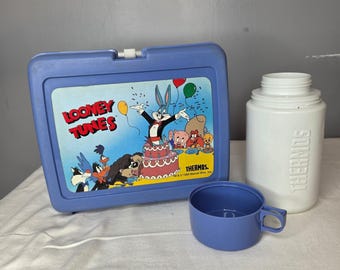 Lonchera de plástico azul con termo y vaso de Looney Tunes, vintage de 1989. LEER