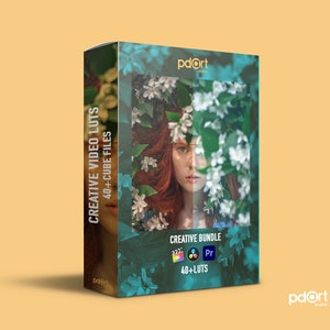 May include: A box of 40+ creative video LUTs for use with Adobe Premiere Pro and Final Cut Pro. The box features a woman with red hair surrounded by white flowers. The text on the box reads "Creative Video LUTs 40+ Cube Files" and "Creative Bundle 40+ LUTs".