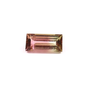 May include: A rectangular, faceted gemstone with a gradient of pink, brown, and green colors.